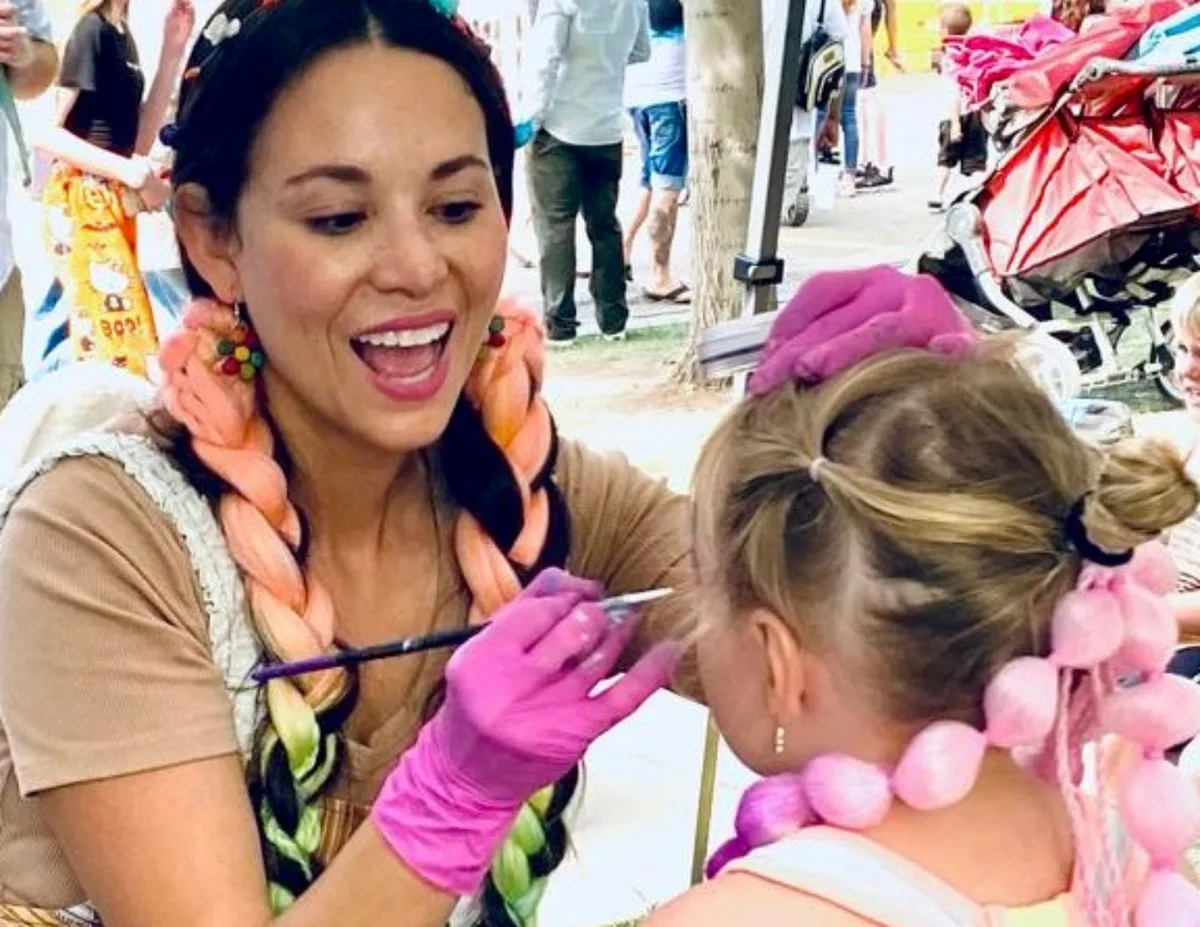 Colory Faces artist working with a child at an event; used as related event-support imagery, not dedicated Party Nannies proof.